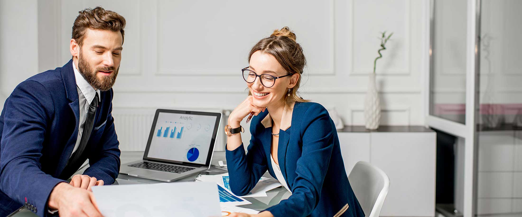 A business owner reviewing finances and tax information online.